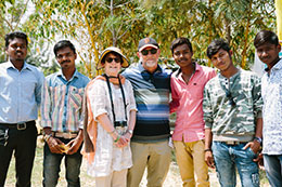 Photo of donors with a group of men. Link to Gifts That Protect Your Assets