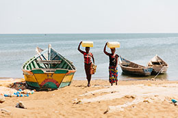 Photo of two people walking on a beach. Links to Donor-Advised Funds