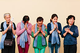 Photo of women praying. Link to Gifts That Pay You Income